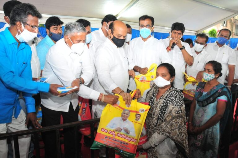 Karnataka Minister V Somanna distributes food grains with Home Minister Basavaraj Bommai2