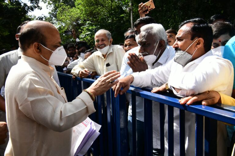 Chief Minister Basavaraj Bommai listening to public grievances near his RT Nagar residence in Bengaluru on Saturday morning.