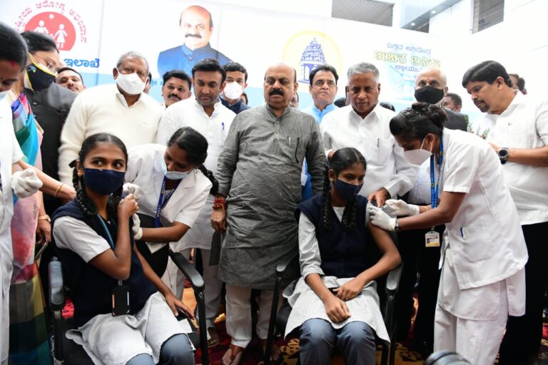 Let's resolve to eradicate Covid CM Bommai college students covid vaccination