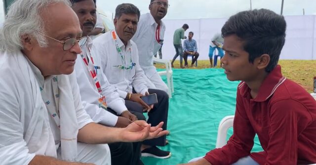 Congress Leader Jairam Ramesh interacting with student during Bharat Jodo Yatra in Karnataka on Thursday.