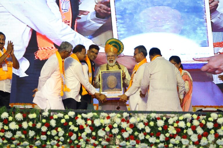 Kudachi MLA P Rajeev is seen felicitation Prime Minister Narendra Modi during his campaign on April 29, 2023.