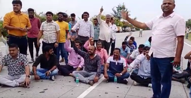 Lorry Association protests by blocking the road on Nice Road in Bangalore