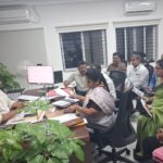 Meeting in an office setting.